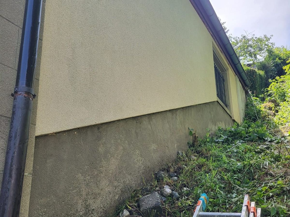 The same façade after cleaning, render back to its original colour